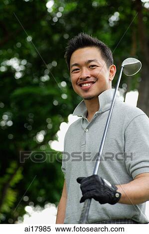 Man with golf club on shoulder, smiling at camera View Large Photo Image Stock Photography - Man with golf club on shoulder, smiling at camera. Fotosearch