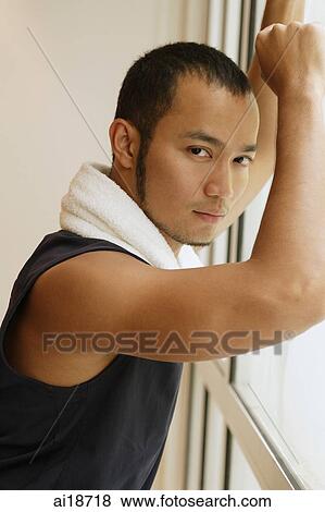 Man with towel around his neck, leaning on window, looking at camera View Large Photo Image Stock Photo - Man with towel around his neck, leaning on window, looking at camera. Fotosearch