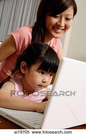 Mother and daughter using laptop View Large Photo Image Stock Photography - Mother and daughter using laptop. Fotosearch