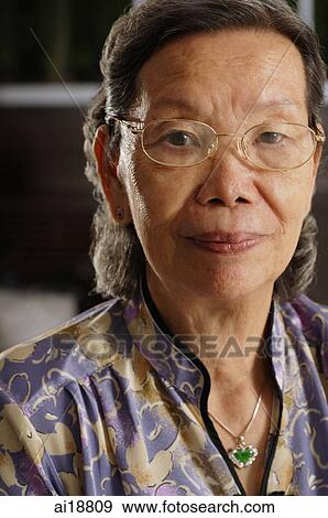 Senior woman looking at camera View Large Photo Image Stock Photo - Senior woman looking at camera. Fotosearch