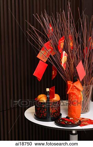 Still life with basket of oranges and red packet View Large Photo Image Stock Image - Still life with basket of oranges and red packet. Fotosearch