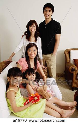 Three generation family looking at camera View Large Photo Image Stock Image - Three generation family looking at camera. Fotosearch