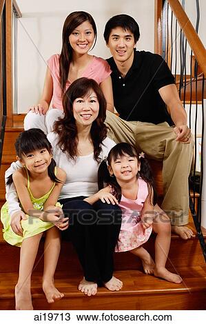 Three generation family sitting on stairs, looking at camera, portrait View Large Photo Image Stock Image - Three generation family sitting on stairs, looking at camera, portrait. Fotosearch