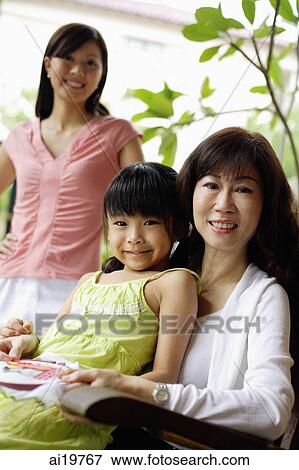 Three generations of females looking at camera View Large Photo Image Stock Photo - Three generations of females looking at camera. Fotosearch