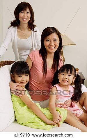 Three generations of females, looking at camera, portrait View Large Photo Image Stock Image - Three generations of females, looking at camera, portrait. Fotosearch