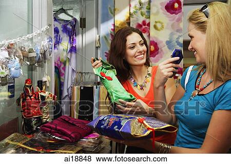 Stock Photo - Two Caucasian women shopping. Fotosearch