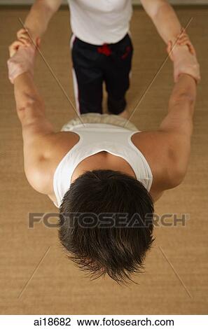 Two men doing stretching exercises View Large Photo Image Stock Image - Two men doing stretching exercises. Fotosearch