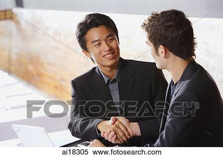 Two men sitting, shaking hands View Large Photo Image Stock Photography - Two men sitting, shaking hands. Fotosearch