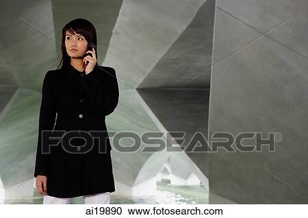 Woman in black jacket, using mobile phone, looking away View Large Photo Image Stock Image - Woman in black jacket, using mobile phone, looking away. Fotosearch