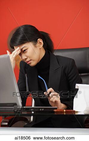 Woman in black turtleneck, sitting in front of laptop View Large Photo Image Stock Photograph - Woman in black turtleneck, sitting in front of laptop. Fotosearch