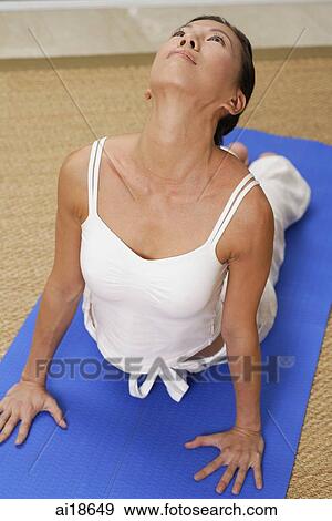 Woman in yoga position View Large Photo Image Stock Photo - Woman in yoga position. Fotosearch