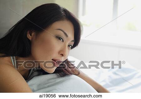 Stock Photograph - Woman looking away, head shot. Fotosearch