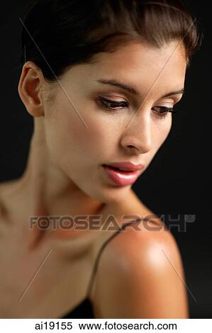Woman looking down, head shot View Large Photo Image Stock Photography - Woman looking down, head shot. Fotosearch