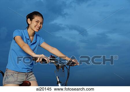 Stock Photography - Woman on bicycle. Fotosearch