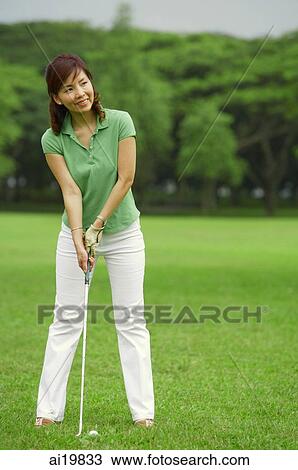 Woman playing golf View Large Photo Image Stock Image - Woman playing golf. Fotosearch