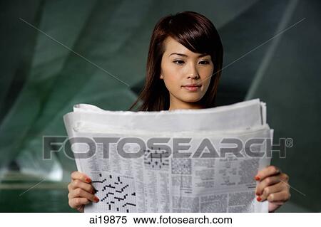 Stock Photography - Woman reading newspaper. Fotosearch