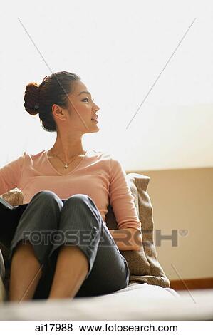 Woman sitting at home View Large Photo Image Stock Photo - Woman sitting at home. Fotosearch