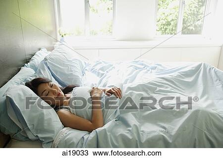 Woman sleeping in bedroom View Large Photo Image Stock Image - Woman sleeping in bedroom. Fotosearch