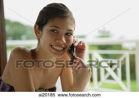 Woman using mobile phone, portrait View Large Photo Image Stock Photography - Woman using mobile phone, portrait. Fotosearch