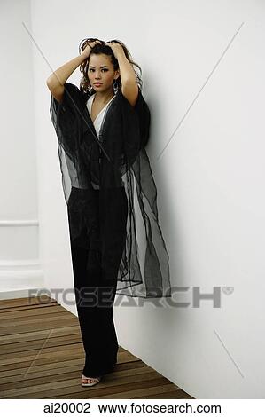 Woman wearing black shawl, looking at camera View Large Photo Image Stock Image - Woman wearing black shawl, looking at camera. Fotosearch