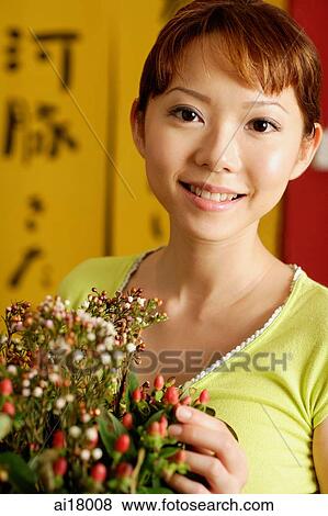 Woman with bouquet of flowers View Large Photo Image Stock Photo - Woman with bouquet of flowers. Fotosearch