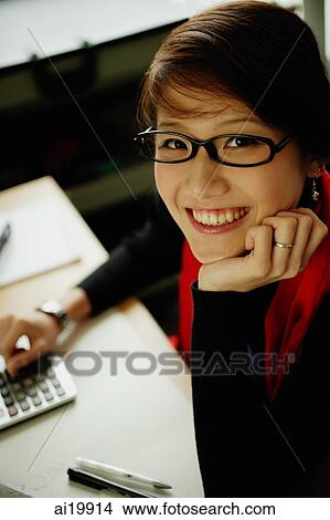 Woman with dark glasses, smiling at camera View Large Photo Image Picture - Woman with dark glasses, smiling at camera. Fotosearch