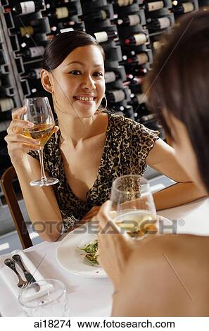 Picture - Women dining in restaurant. Fotosearch