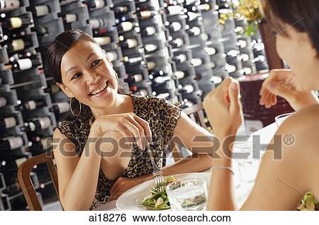 Women having a meal in restaurant View Large Photo Image Stock Photograph - Women having a meal in restaurant. Fotosearch