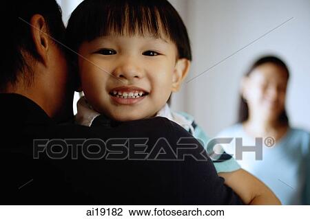 Young boy looking over father's shoulder View Large Photo Image Stock Image - Young boy looking over father's shoulder. Fotosearch