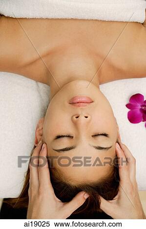 Young woman having head massaged View Large Photo Image Stock Photography - Young woman having head massaged. Fotosearch