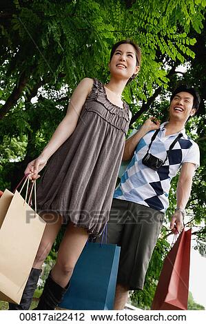 A couple go shopping together View Large Photo Image Stock Image - A couple go shopping together. Fotosearch