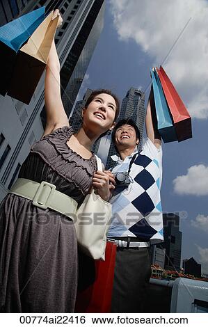 A couple go shopping together View Large Photo Image Stock Photograph - A couple go shopping together. Fotosearch