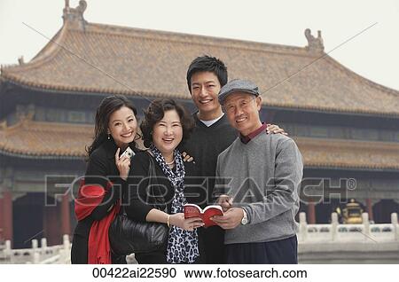 A family look at the camera as they pose in front of The Forbidden City, Beijing View Large Photo Image Stock Image - A family look at the camera as they pose in front of The Forbidden City, Beijing. Fotosearch