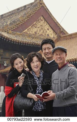 A family look at the camera as they pose in front of The Forbidden City, Beijing View Large Photo Image Stock Image - A family look at the camera as they pose in front of The Forbidden City, Beijing. Fotosearch