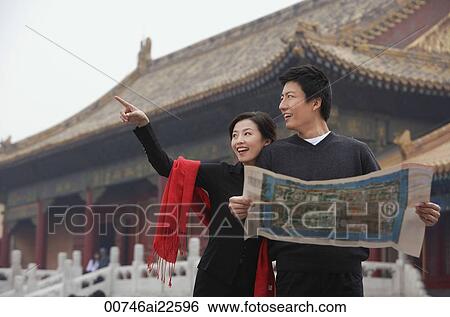 A tourist couple look at a map together in front of The Forbidden City, Beijing View Large Photo Image Stock Photograph - A tourist couple look at a map together in front of The Forbidden City, Beijing. Fotosearch