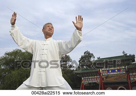 Stock Photography - An old man practices Chinese martial arts. Fotosearch