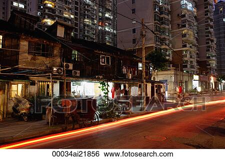 Stock Photograph - Apartment Buildings at night in Shanghai, China. Fotosearch