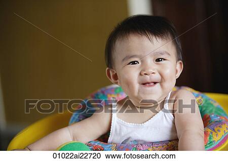 Stock Image - Baby smiling at camera. Fotosearch