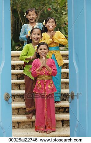 Balinese girls smiling at camera View Large Photo Image Stock Photograph - Balinese girls smiling at camera. Fotosearch