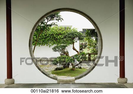 Bonsai trees seen through circular window at the Chinese Garden, Singapore View Large Photo Image Stock Photograph - Bonsai trees seen through circular window at the Chinese Garden, Singapore. Fotosearch