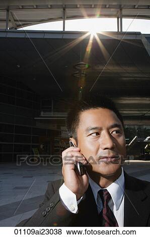 Stock Photo - Businessman on a mobile phone. Fotosearch