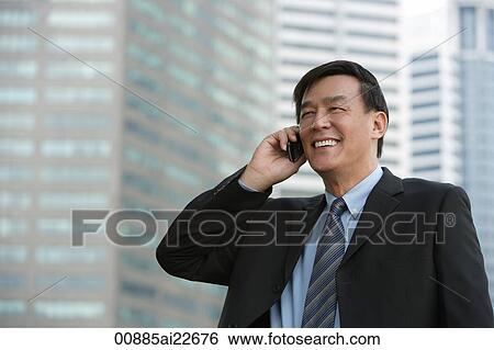 Businessman on the phone View Large Photo Image Stock Photograph - Businessman on the phone. Fotosearch