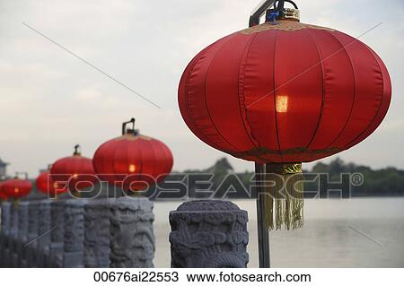 Stock Image - Chinese lanterns next to water. Fotosearch