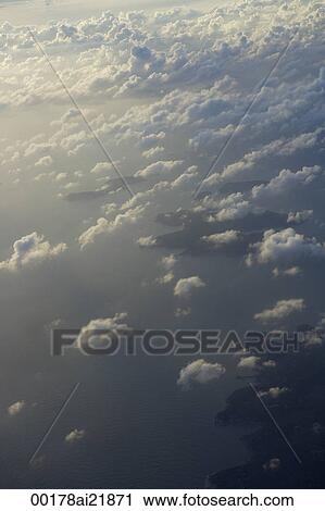 Clouds over Hong Kong, view from plane window View Large Photo Image Stock Image - Clouds over Hong Kong, view from plane window. Fotosearch
