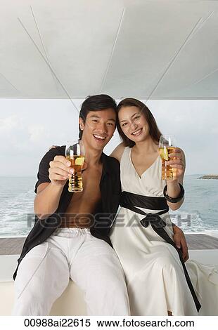 Couple on yacht, smiling at camera View Large Photo Image Stock Photography - Couple on yacht, smiling at camera. Fotosearch