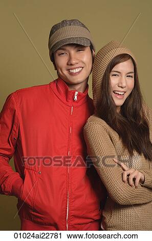 Couple smiling at camera View Large Photo Image Stock Image - Couple smiling at camera. Fotosearch