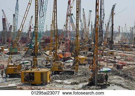 Stock Photo - Cranes on a construction site. Fotosearch