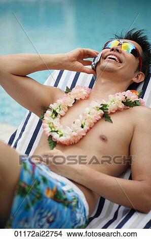 Man in deck chair talking on the phone View Large Photo Image Picture - Man in deck chair talking on the phone. Fotosearch