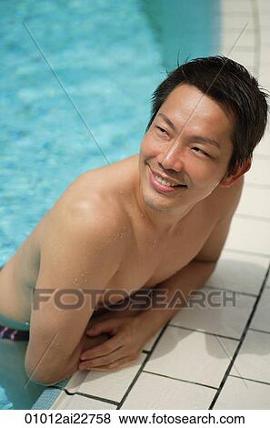 Man in pool looking into distance View Large Photo Image Stock Photo - Man in pool looking into distance. Fotosearch