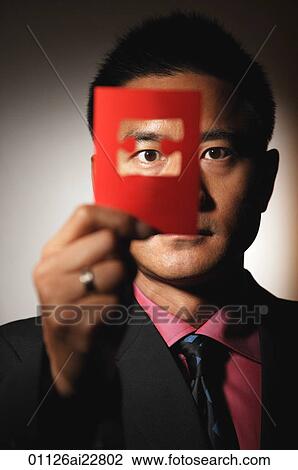 Man looking through puzzle piece cutout View Large Photo Image Stock Image - Man looking through puzzle piece cutout. Fotosearch